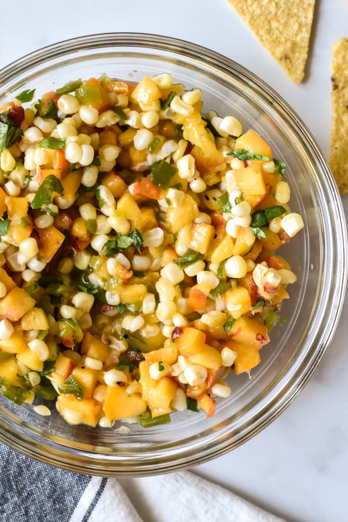 peach, corn and hatch green chile salsa in a large bowl