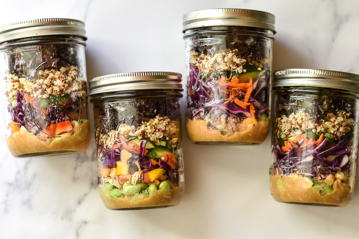 rainbow quinoa salad in a jar all lined up