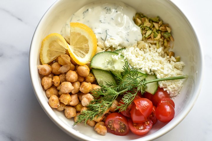 chickpea bowl with toppings and tzatziki sauce