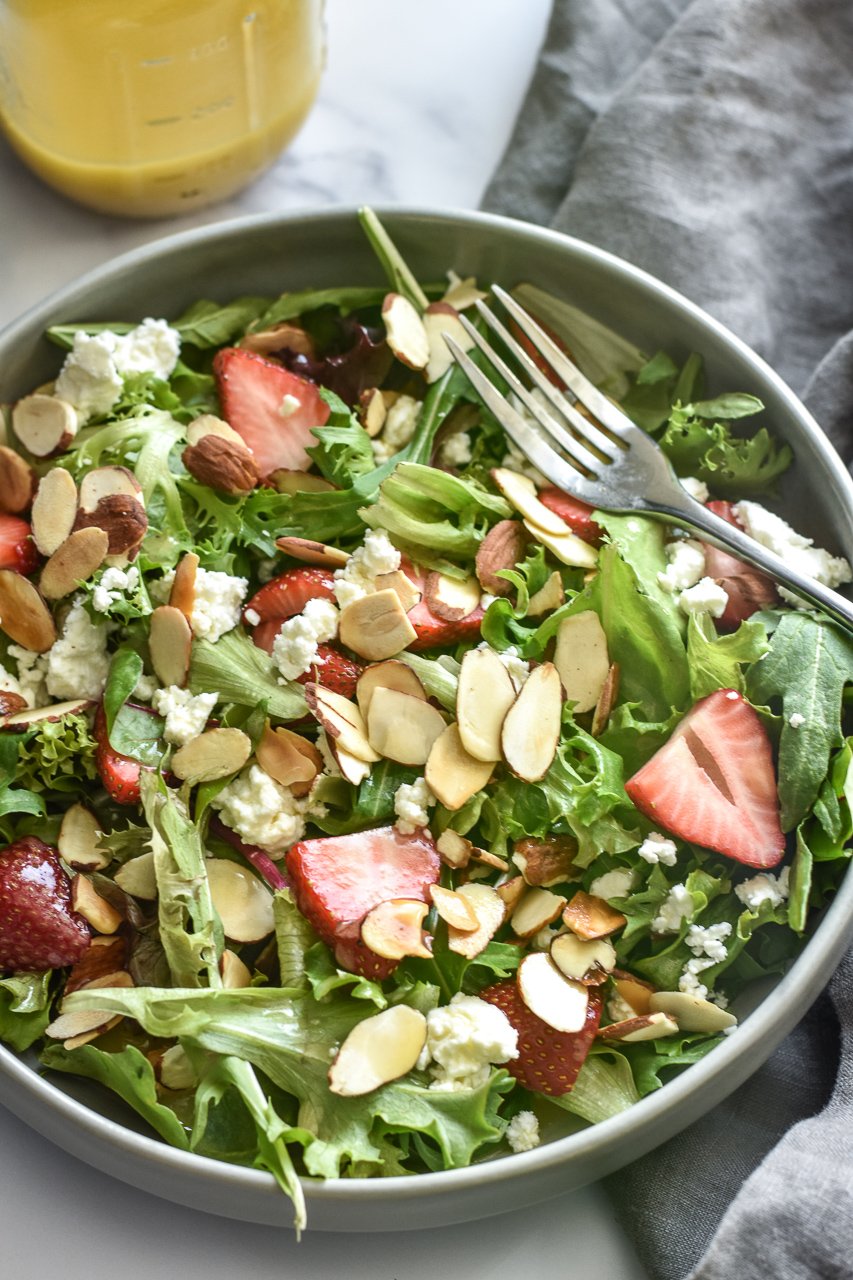 strawberry goat cheese salad in a bowl