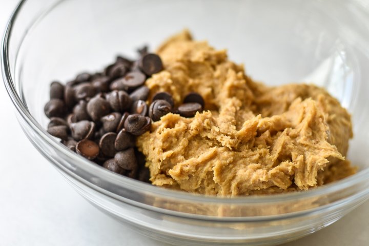 vegan chickpea cookie dough in a bowl with chocolate chips