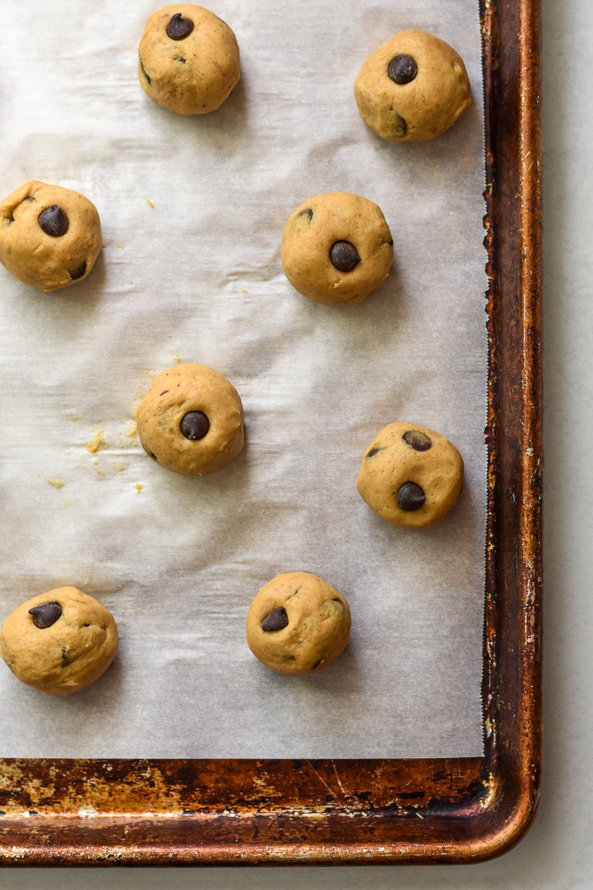 cookie dough bites on a sheet pan lined with parchment paper