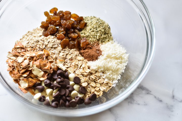 oats chocolate chips raisins coconut and hemp hearts in a bowl