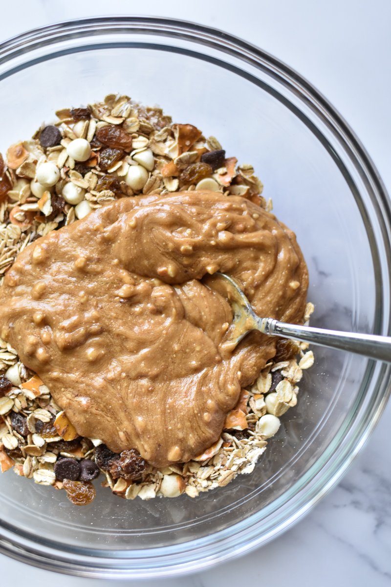 large bowl with oats chocolate chips raisins and peanut butter
