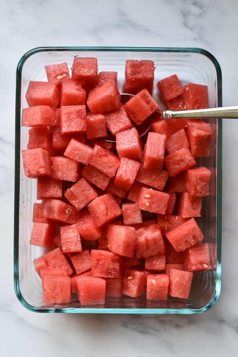 watermelon cubes in a glass food storage container