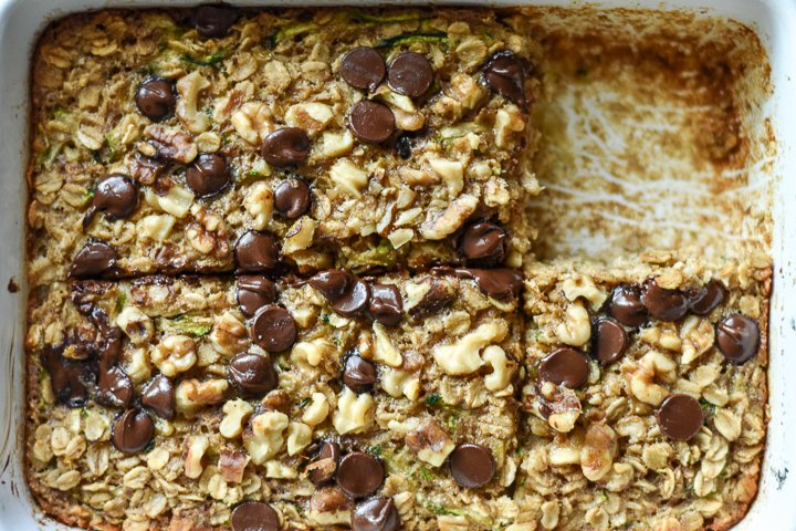 dish of zucchini banana bread baked oatmeal with chocolate chips and walnuts