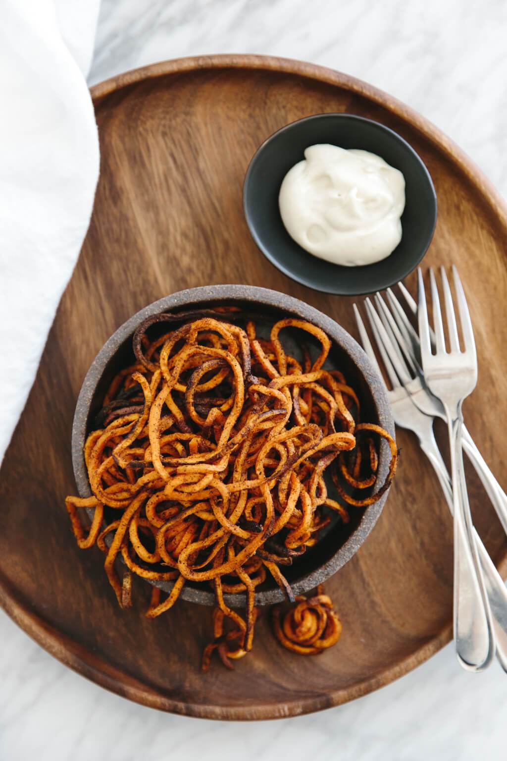 curly sweet potato fries in a bowl