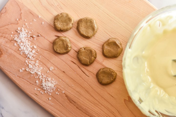 sunflower seed butter discs and salt on a cutting board