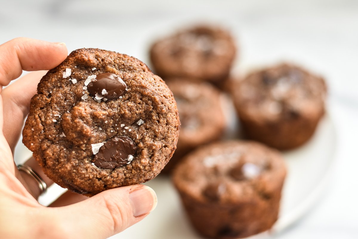 close-up of muffin with plate of muffins in the background