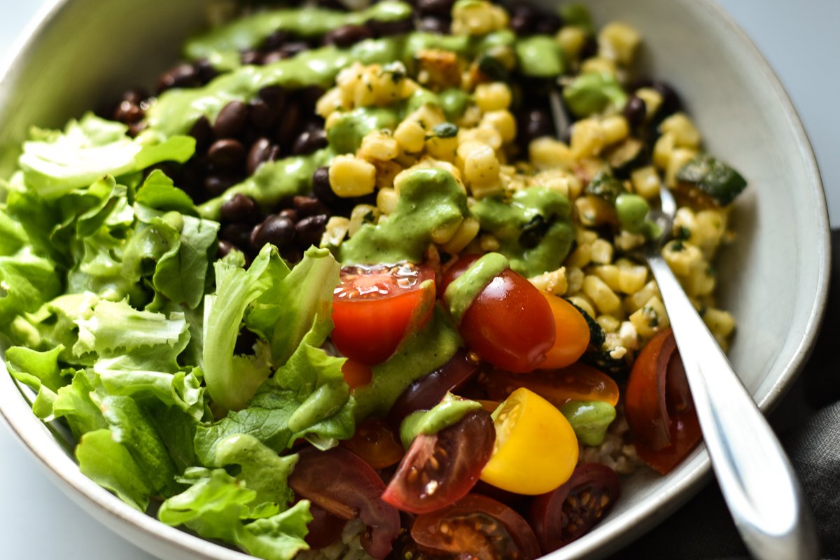 vegetarian burrito bowl with a drizzle of green goddess dressing