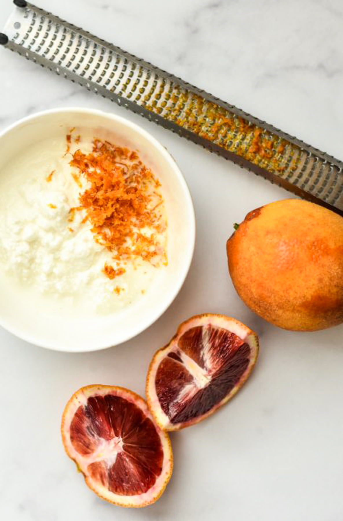 ricotta cheese, blood oranges and microplane