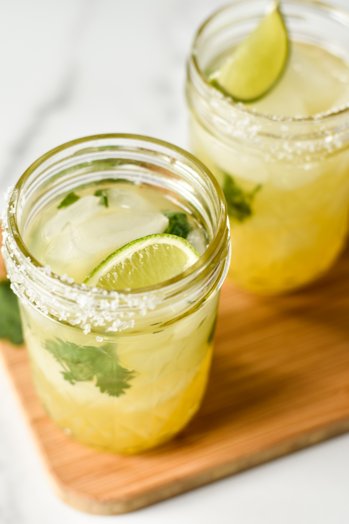 closeup of a margarita with a lime wedge