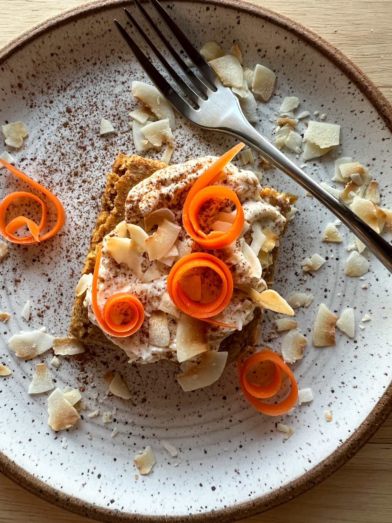 carrot cake baked oats on a plate with fork