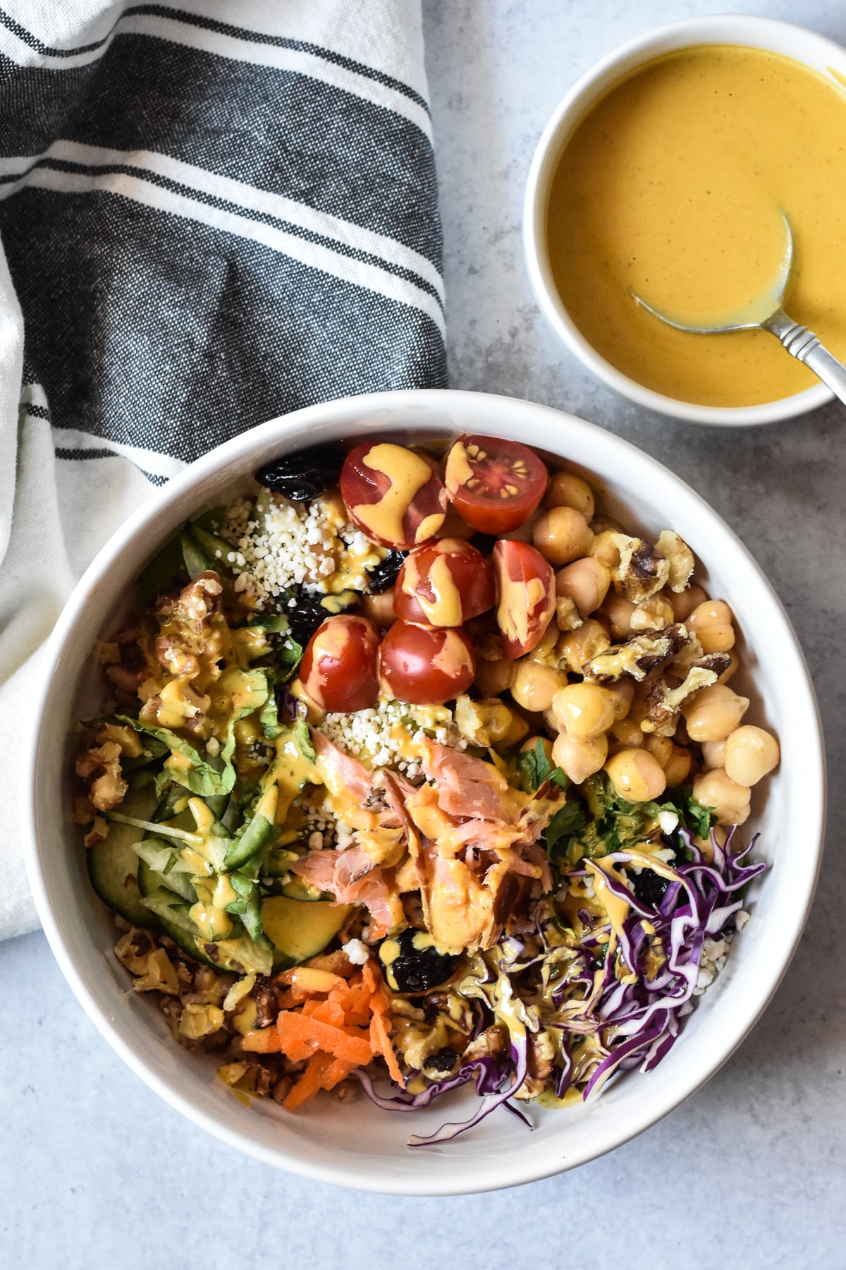 nourish bowl with a side of tahini sauce