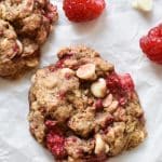 cookie with raspberries on parchment paper