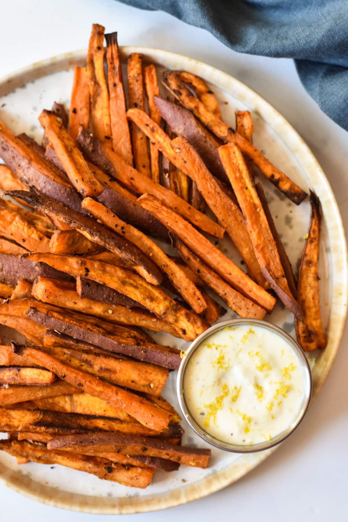 plate of sweet potato fries with aioli sauce