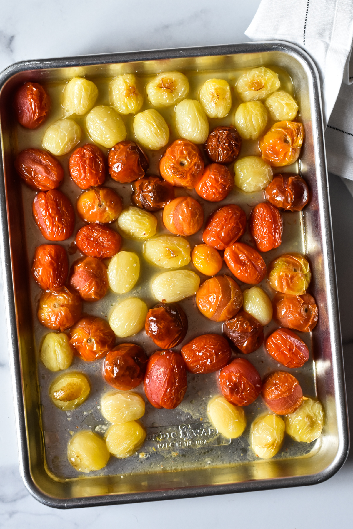 sheet pan of oven roasted tomatoes