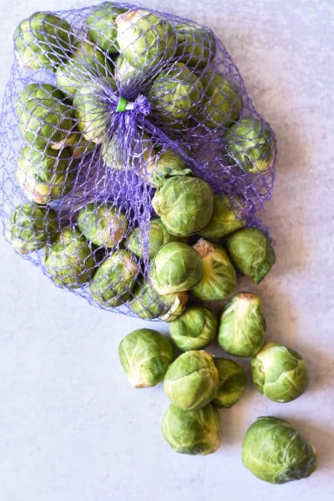 brussels sprouts spilling out of a bag