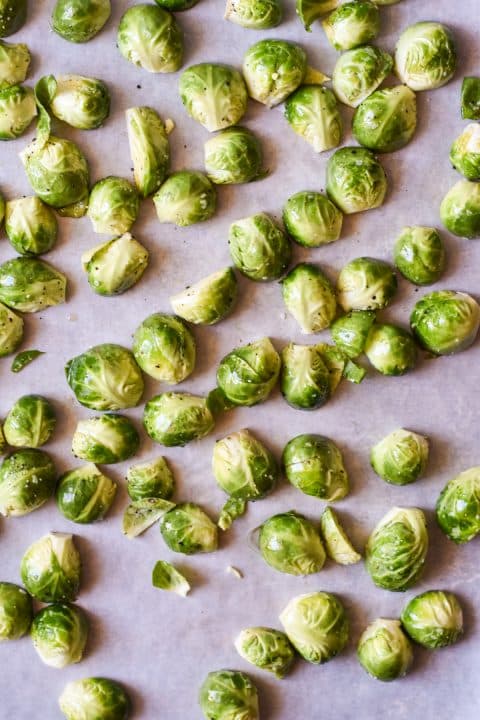 brussels sprouts spread out on a sheet pan