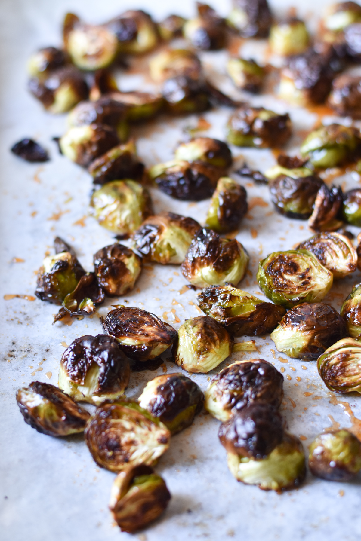 honey sriracha brussels sprouts on a sheet pan