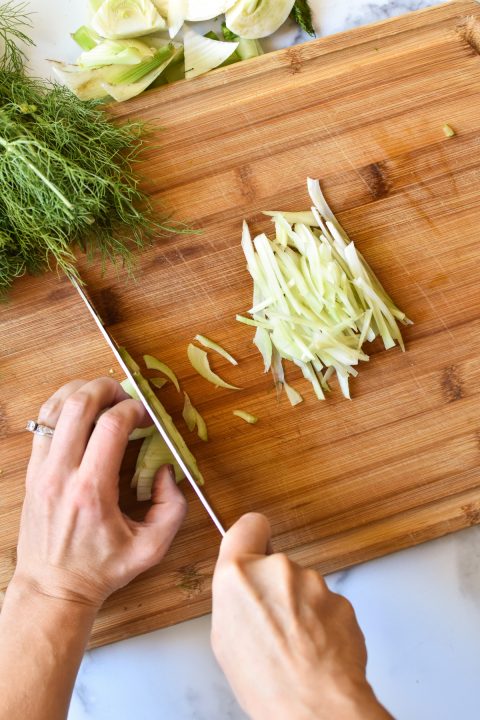 thinly slicing fennel