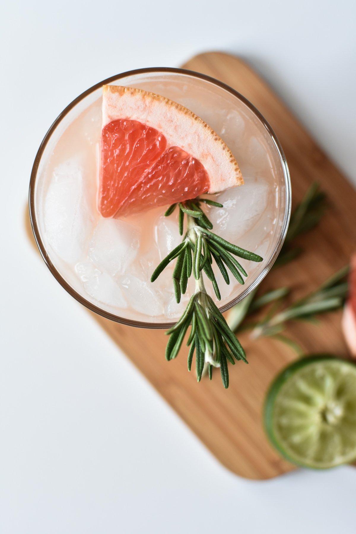 grapefruit mocktail with rosemary sprig in a glass