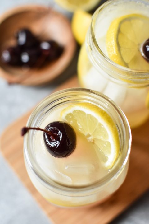 tom collins mocktail with lemon and cherry