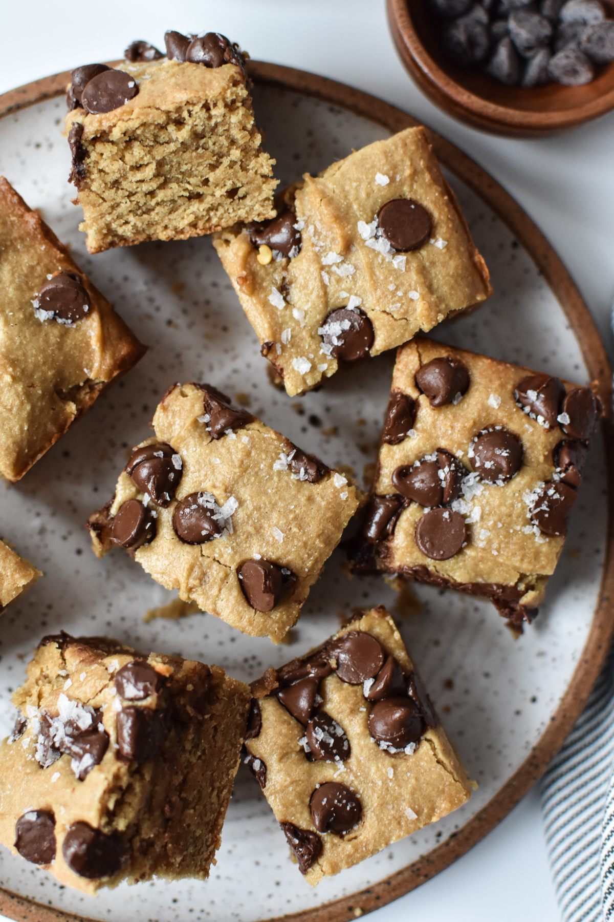 plate of vegan blondies with chocolate chips and flaky salt