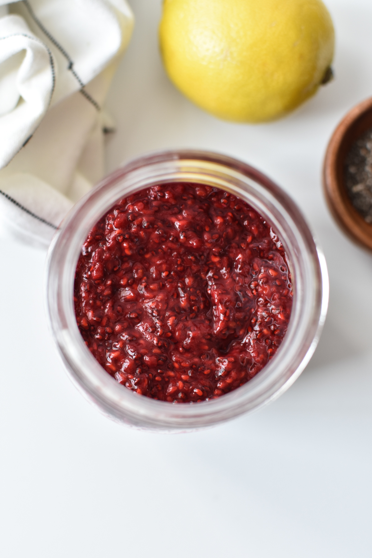 overhead view of raspberry jam in a jar