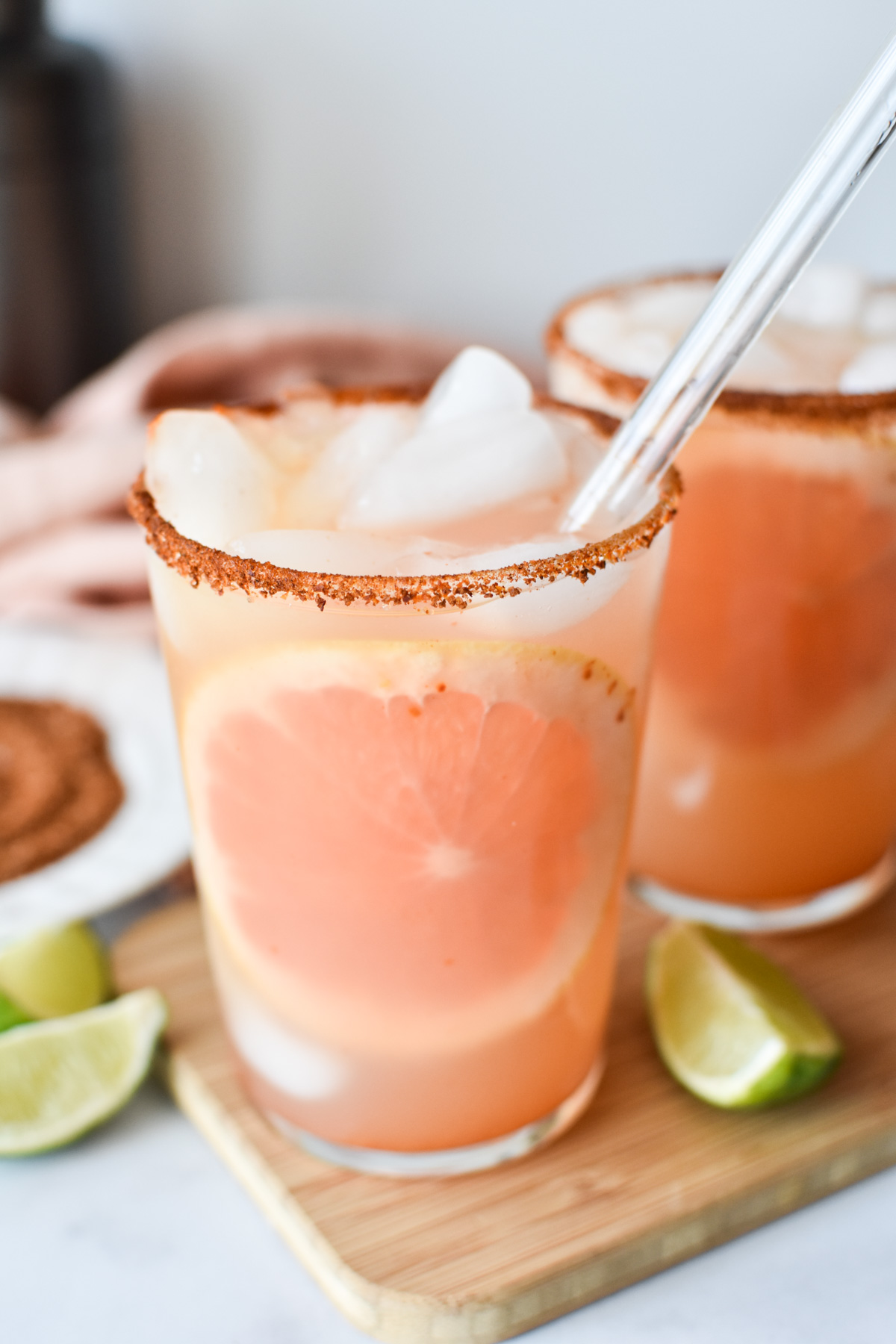 grapefruit cocktail in a tall glass with chile rim