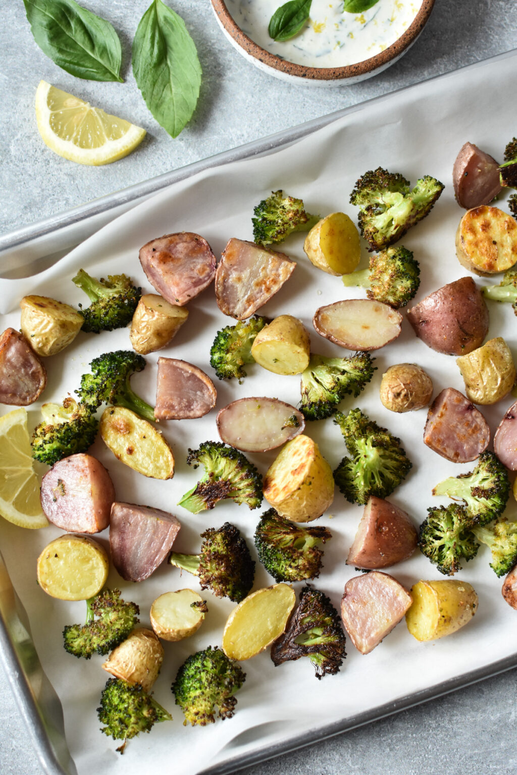 roasted potatoes and broccoli on a sheet pan