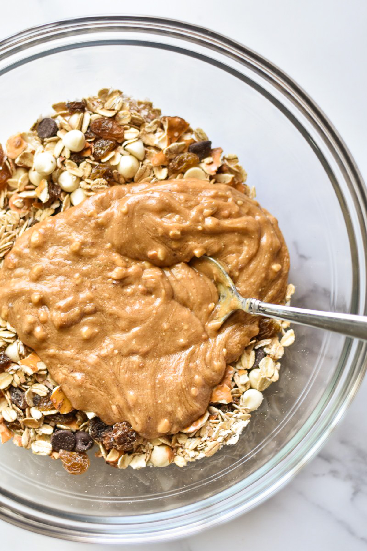 big bowl of oats with pool of peanut butter on top