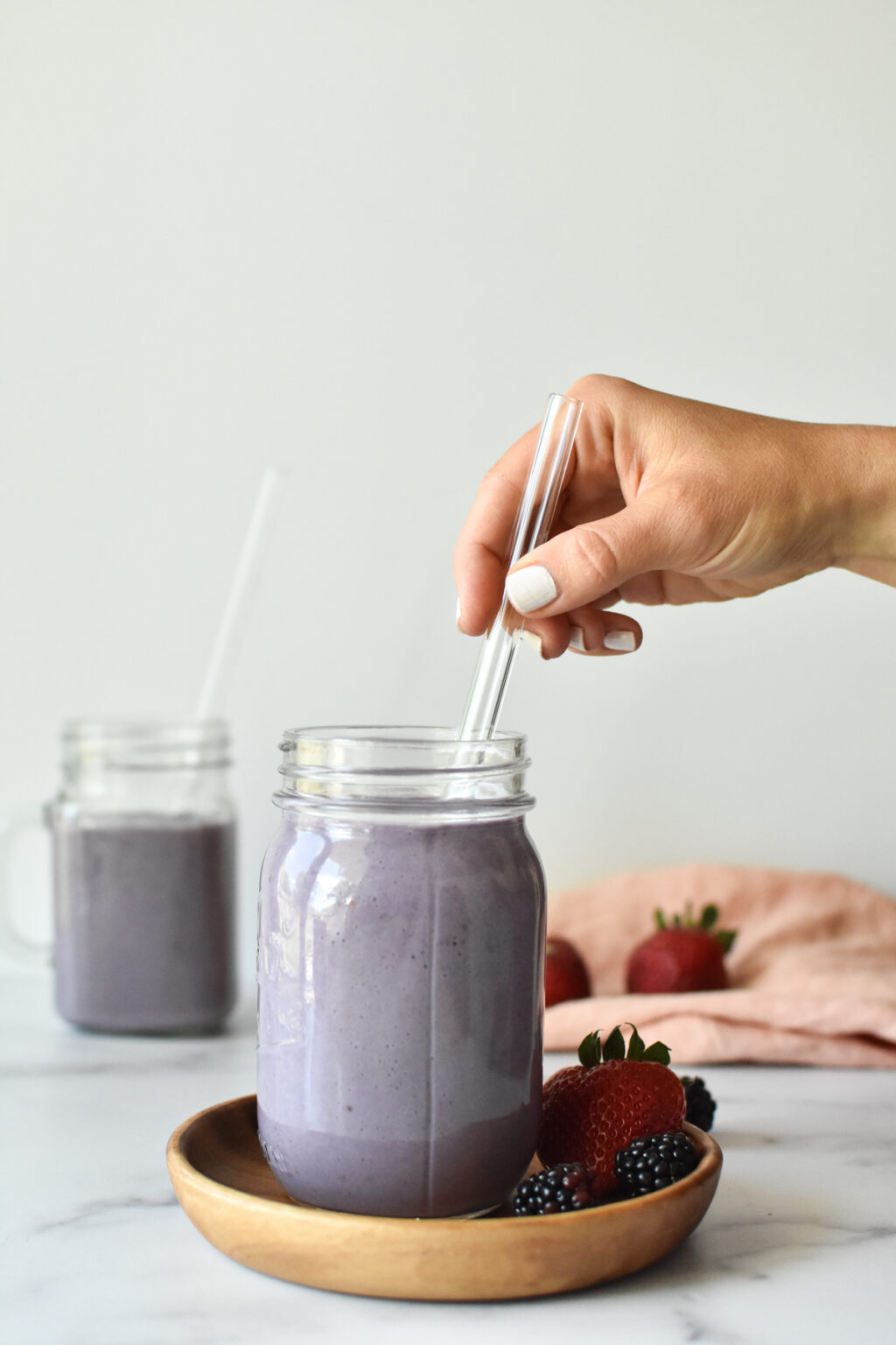 smoothie in glass with straw