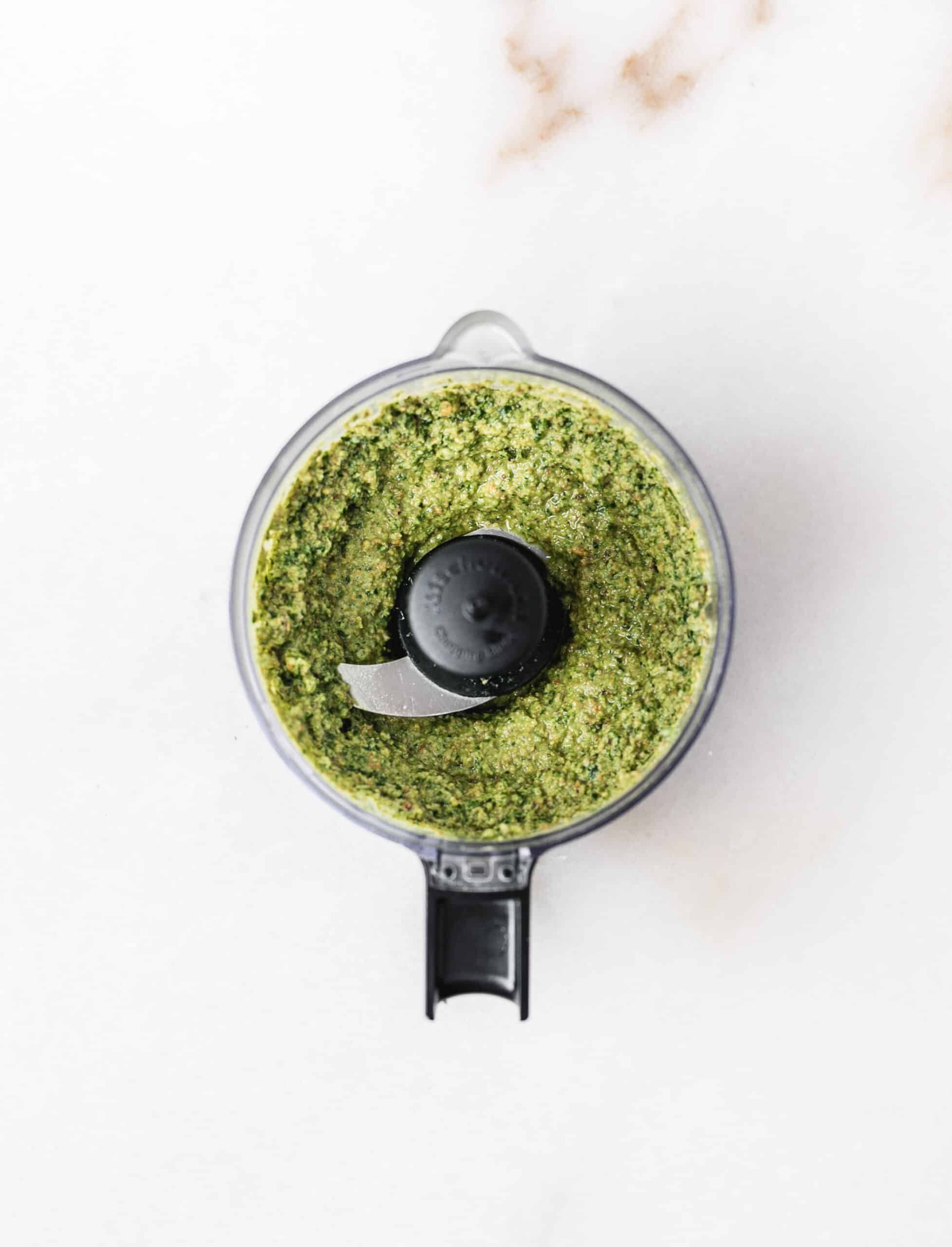 food processor with pistachio pesto blended up